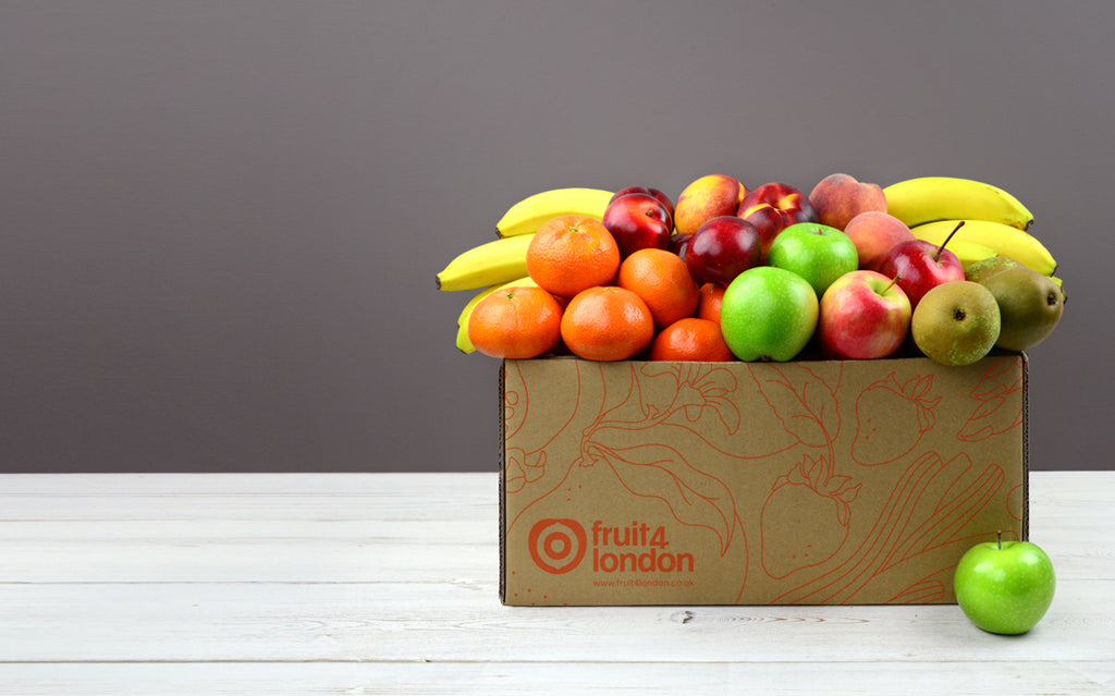 Apples, bananas, pears, clementines or satsumas and seasonal vegetables in an Office Fruit Box