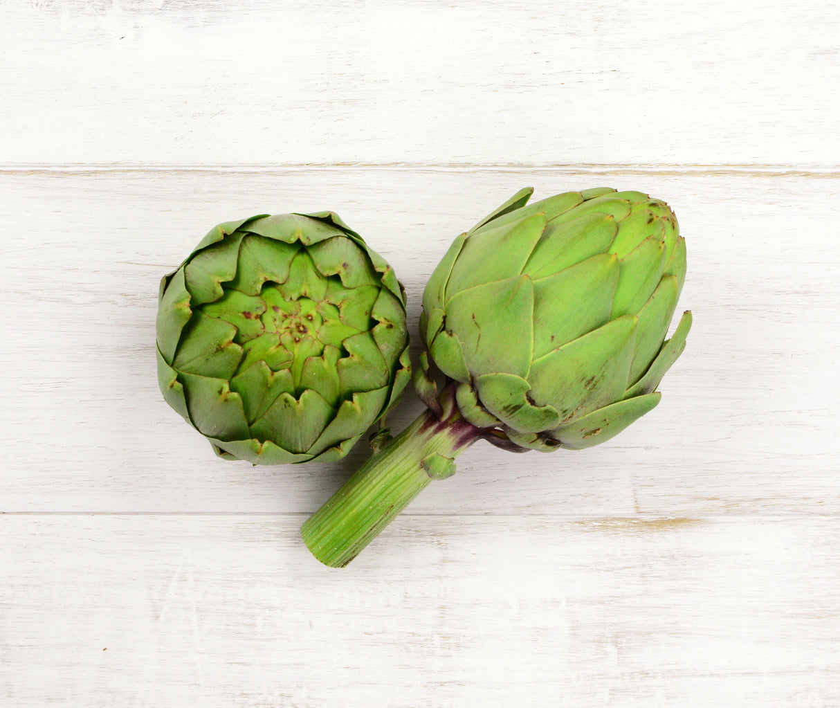 Two large Artichoke heads locally sourced for Office Delivery