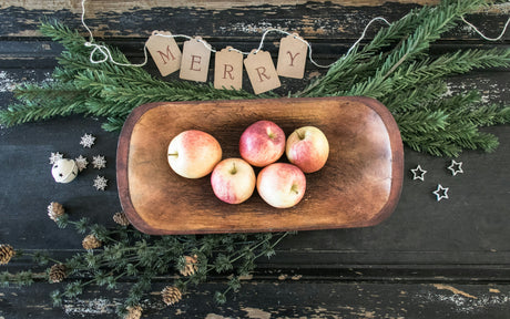 A Christmas fruit gift basket containing apples