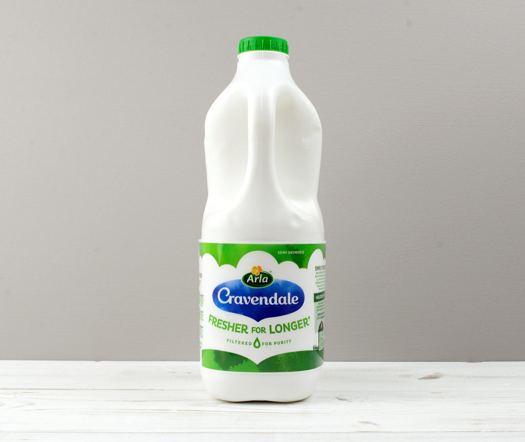 Arla Cravendale 2 litres Semi-Skimmed milk with a green bottle cap 