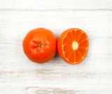 One sliced Clementine locally sourced and perfect for your customised Fruit Box