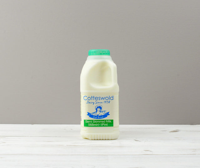 Cotteswold 1 pint of Semi Skimmed milk carton with a green cap ready for Home Delivery
