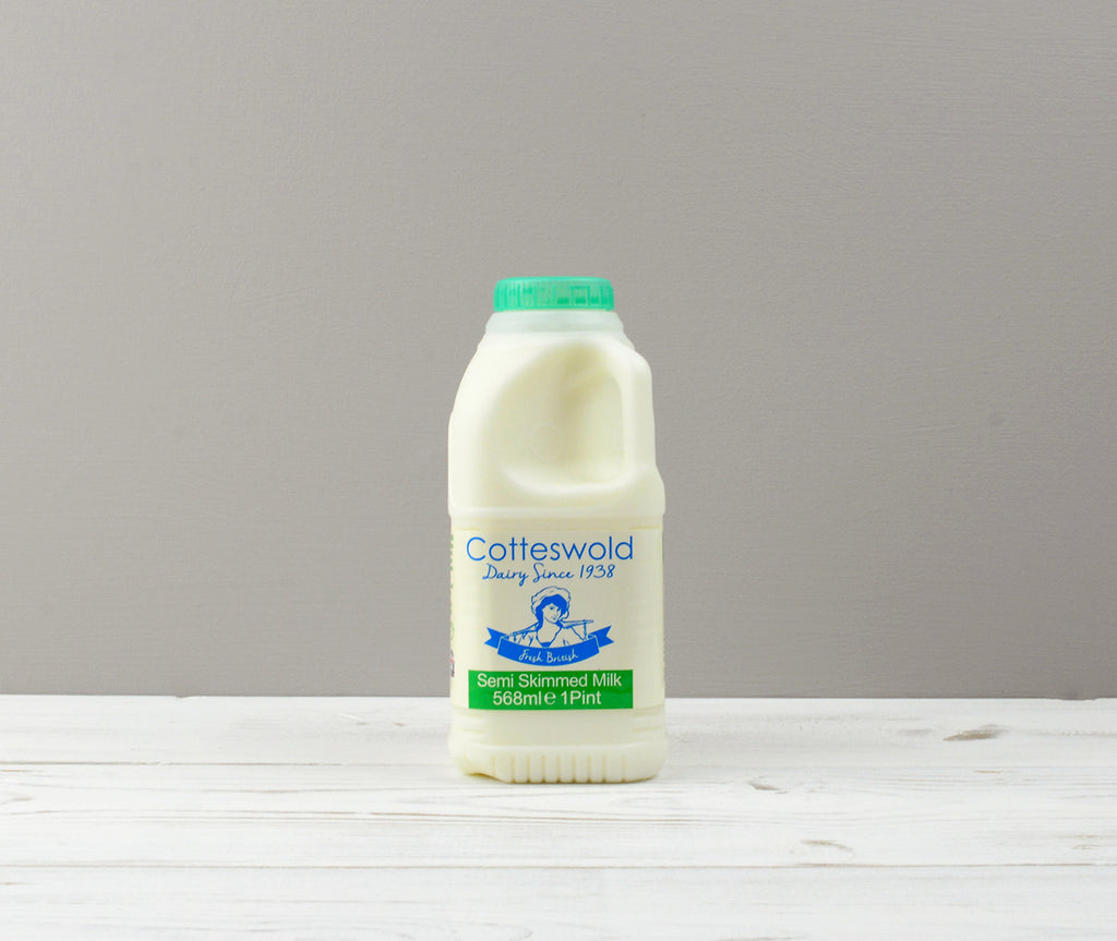 Cotteswold 1 pint of Semi Skimmed milk carton with a green cap ready for Home Delivery