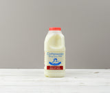 Cotteswold 1 pint of Skimmed milk carton with a red cap ready for Home Delivery