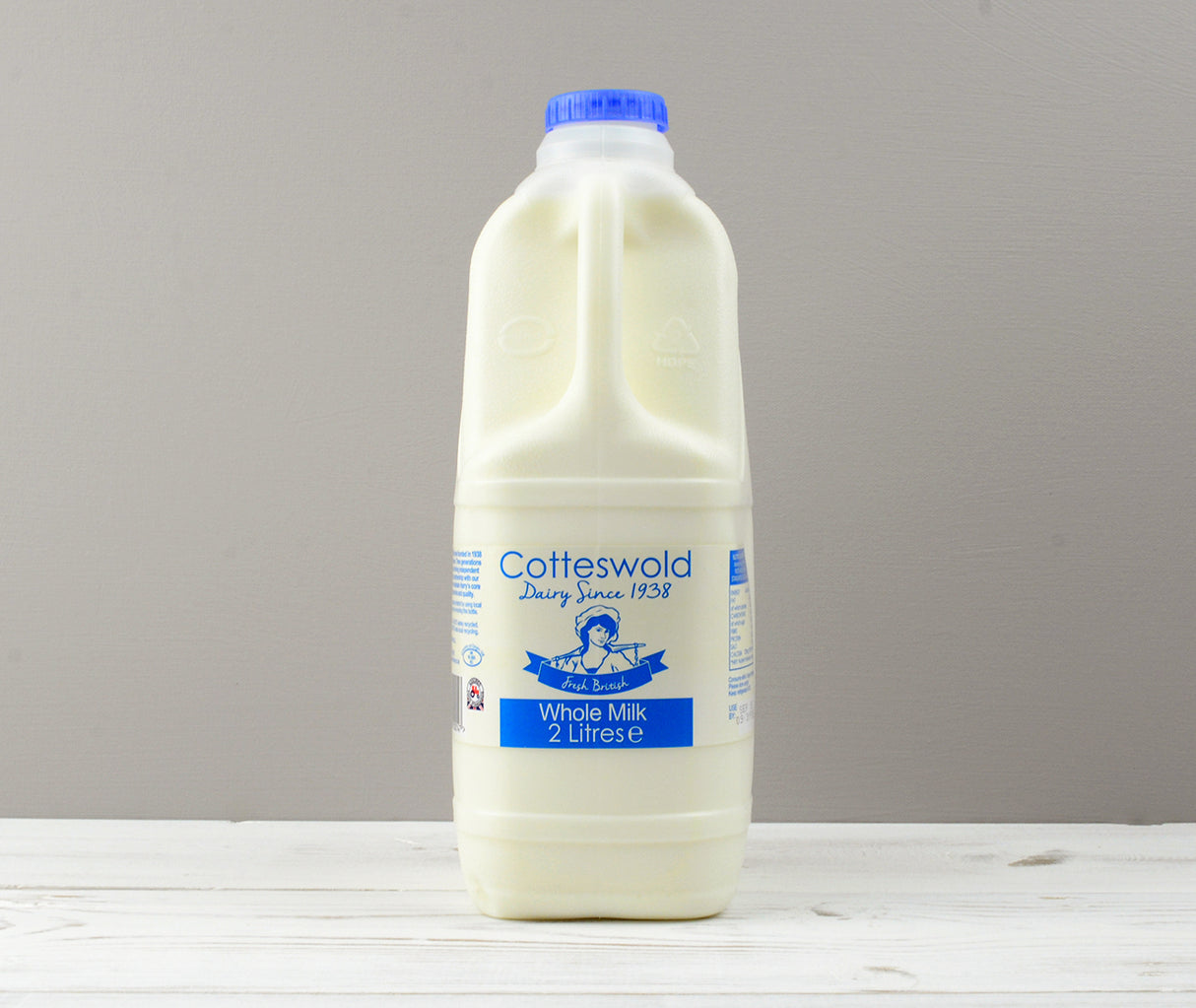 Cotteswold 2 litres of whole milk carton with blue cap ready for Home Delivery