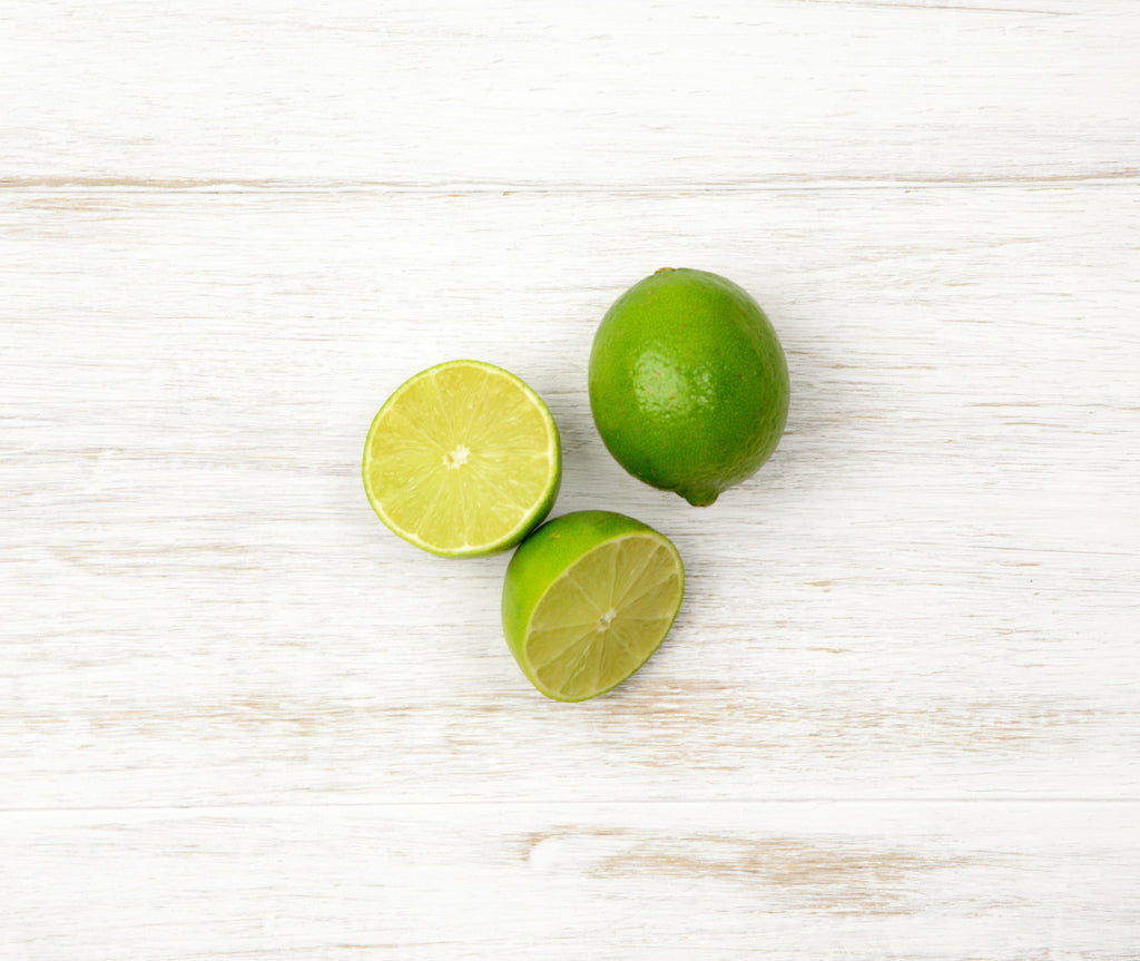 One sliced and one whole Lime locally sourced and perfect for your customised Fruit Box